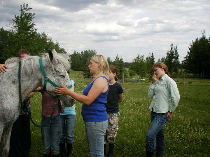 Andonia teaching lesson students during a horsemanship session